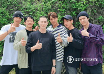 EXO members send off EXO Suho to military training