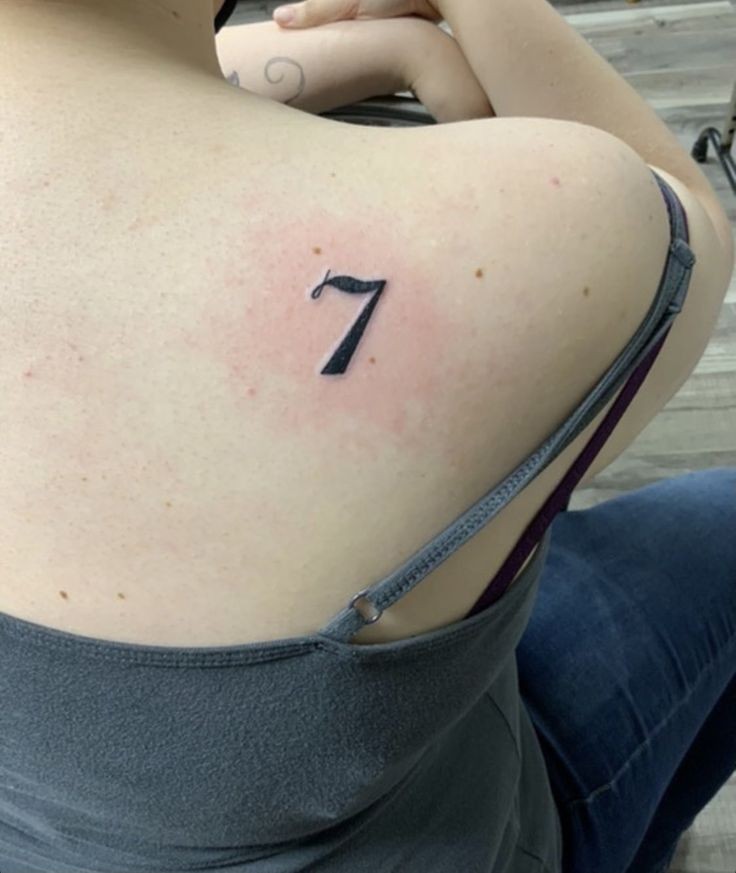 Number 7 tattoo on the forearm