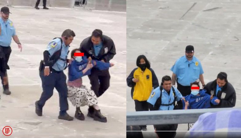 Officials dragging someone out of the KAMP LA 2022 Kpop festival. | Twitter